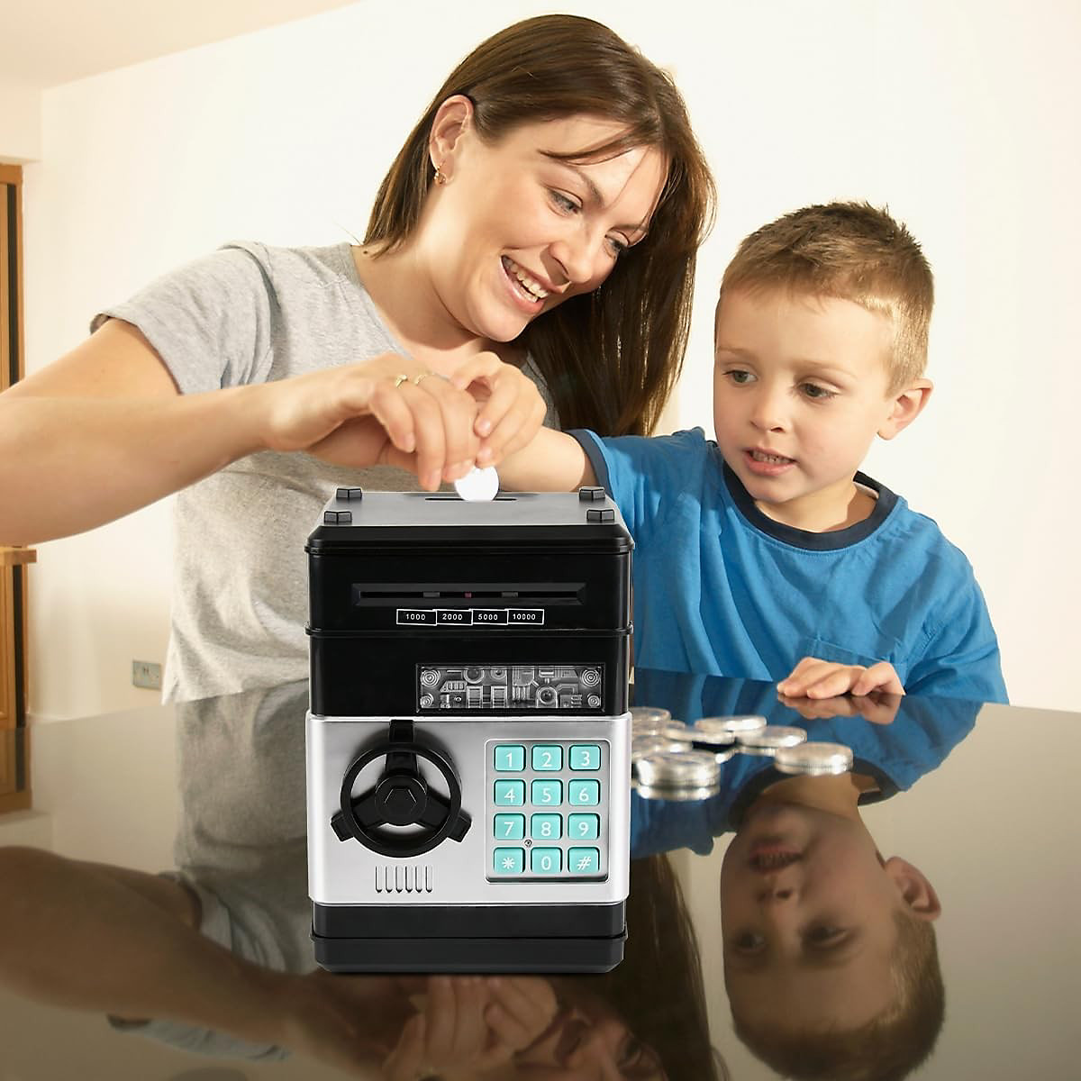 A parent and child putting coins into a toy savings safe